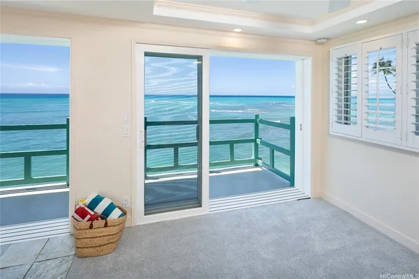 a large room with a large window and furniture