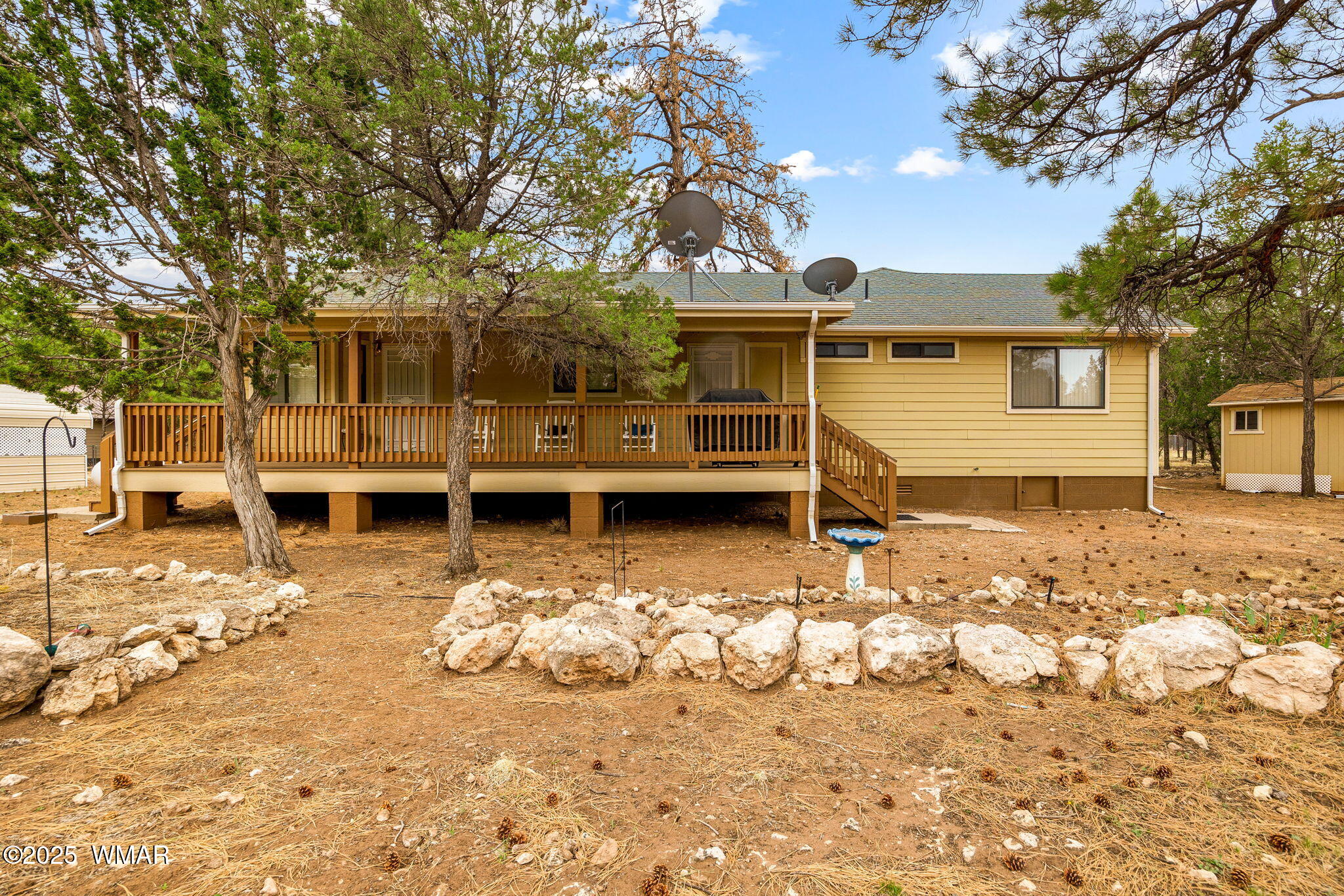 2088 Round-Up Road Overgaard, AZ 85933 - Photo 19 of 35 front view of a house with a yard