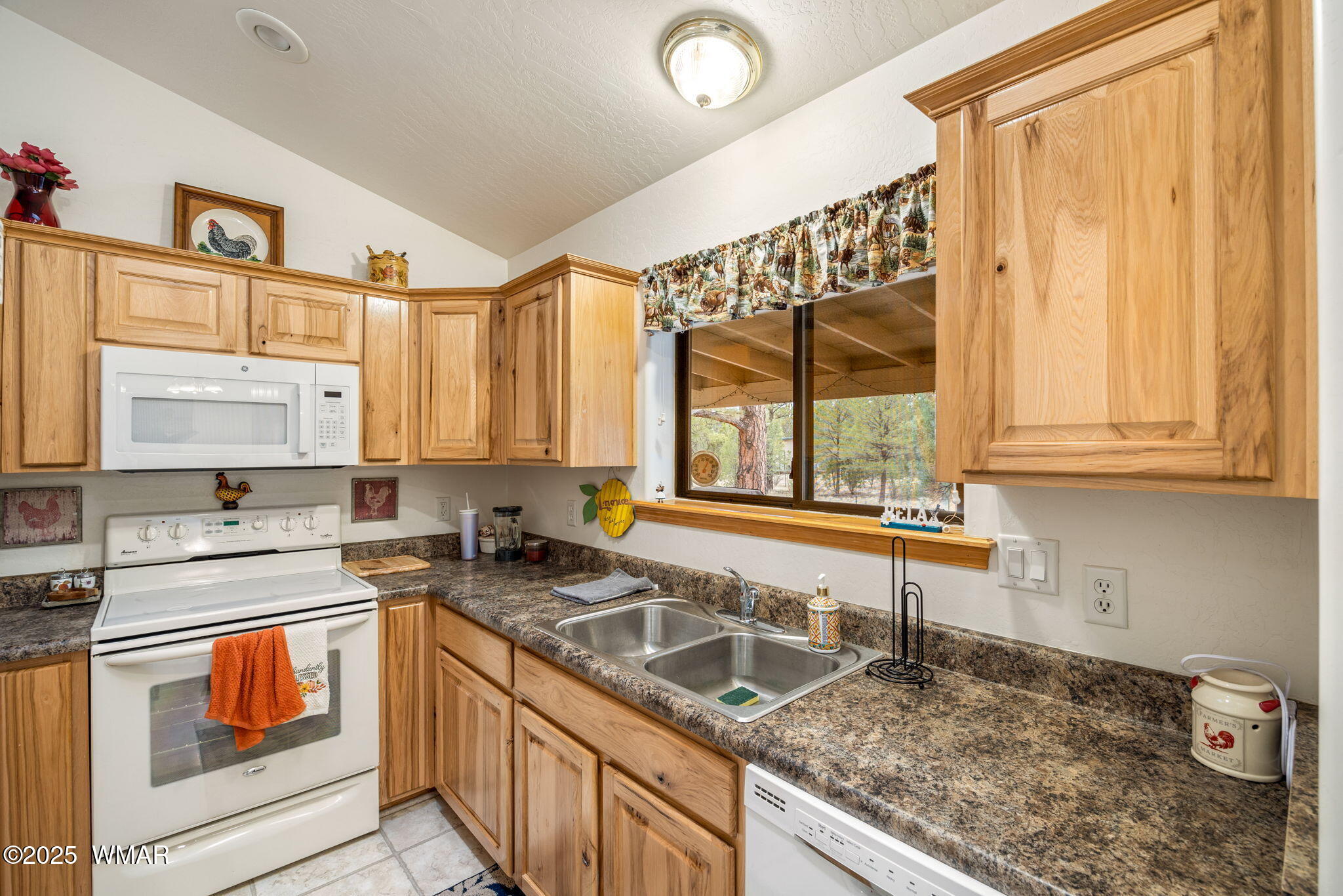 2088 Round-Up Road Overgaard, AZ 85933 - Photo 4 of 35 a kitchen with a sink stove top oven and cabinets