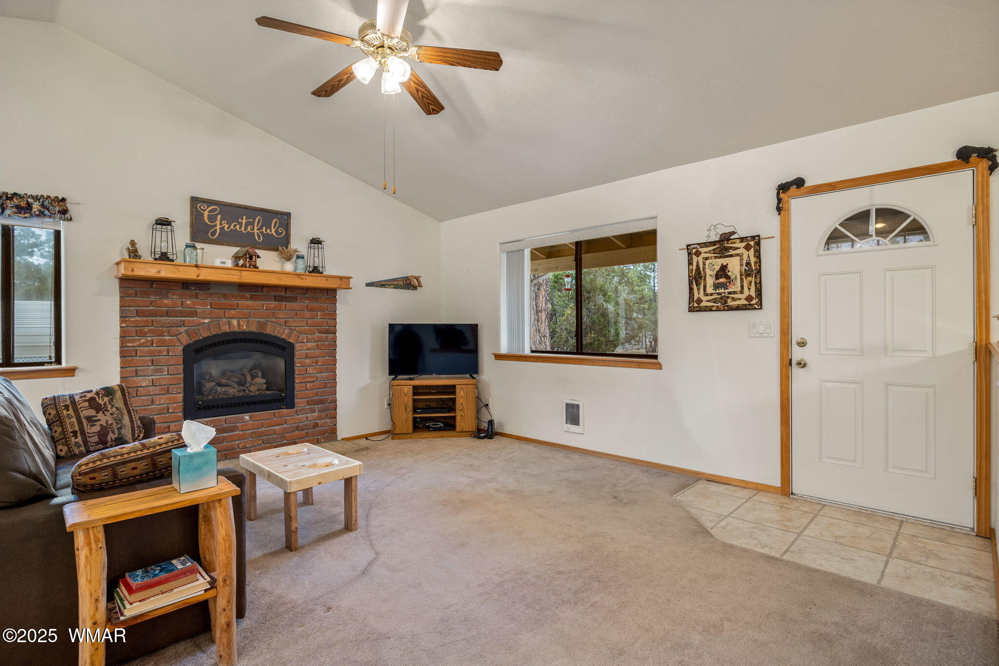 2088 Round-Up Road Overgaard, AZ 85933 - Photo 5 of 35 a living room with furniture and a fireplace