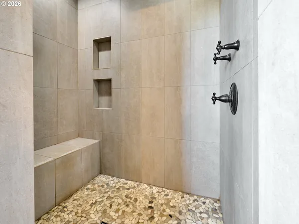 a bathroom with a bathtub and shower