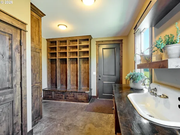 a bathroom with a tub shower and sink