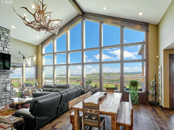 a view of a living room with furniture and window
