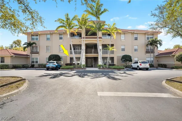 a group of cars parked in front of a building