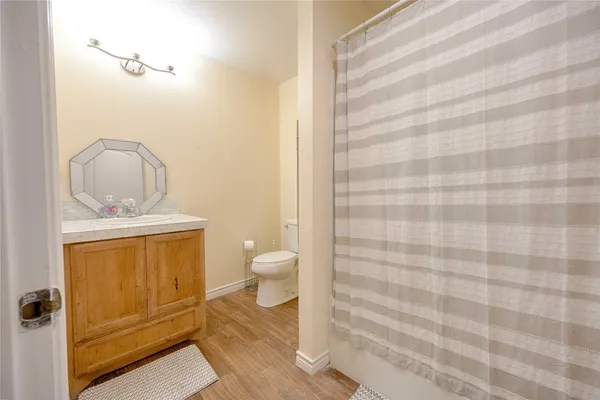a bathroom with a toilet and a sink