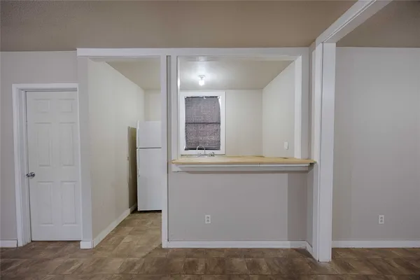a view of cabinets and window