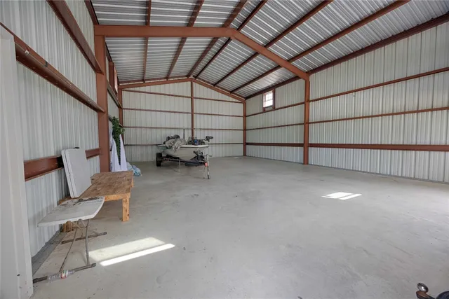 a view of patio with table and chairs
