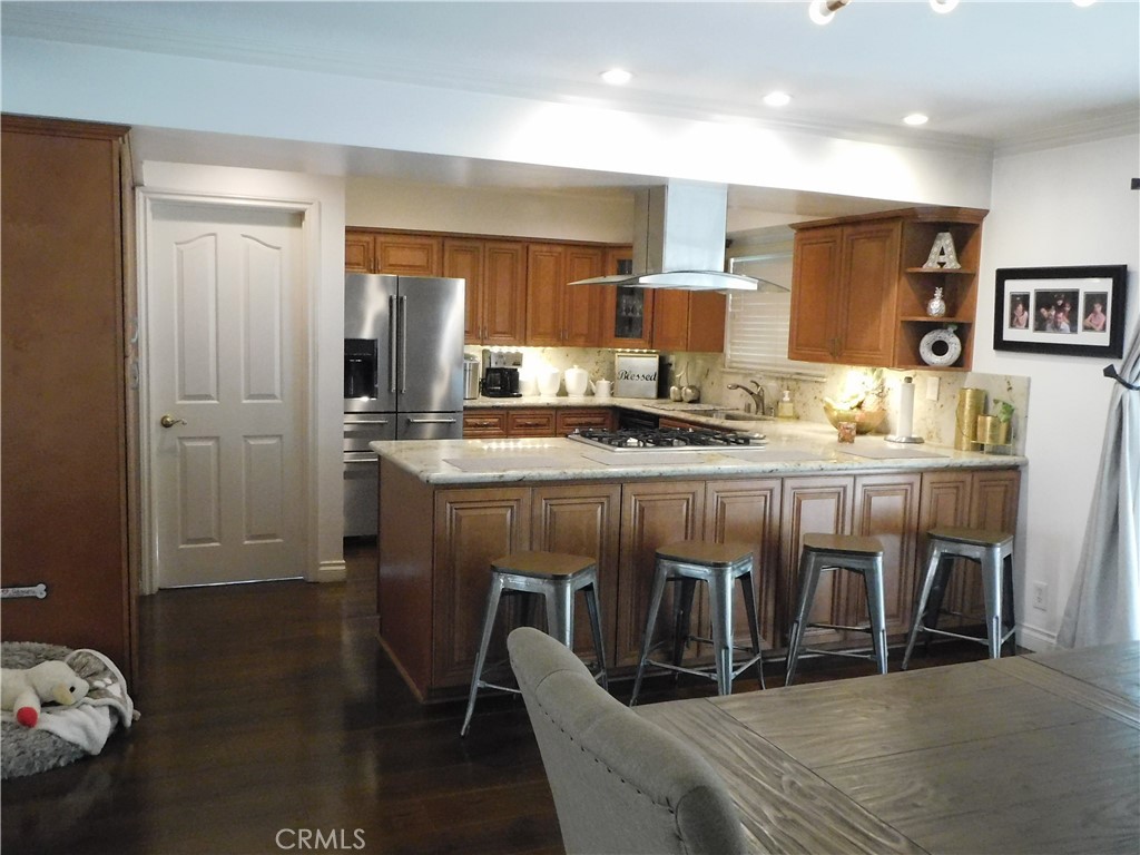 2013 Morning Canyon Road Diamond Bar, CA 91765 - Photo 17 of 26 a kitchen with stainless steel appliances granite countertop a stove a sink and a refrigerator