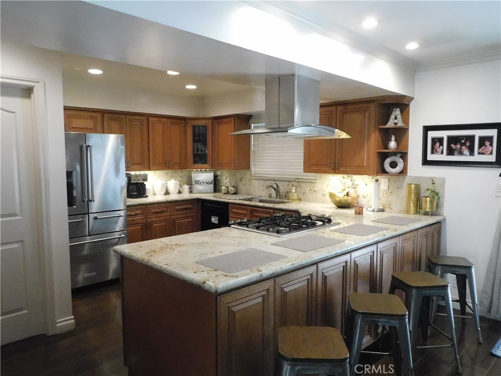 2013 Morning Canyon Road Diamond Bar, CA 91765 - Photo 18 of 26 a kitchen with a table chairs refrigerator and microwave