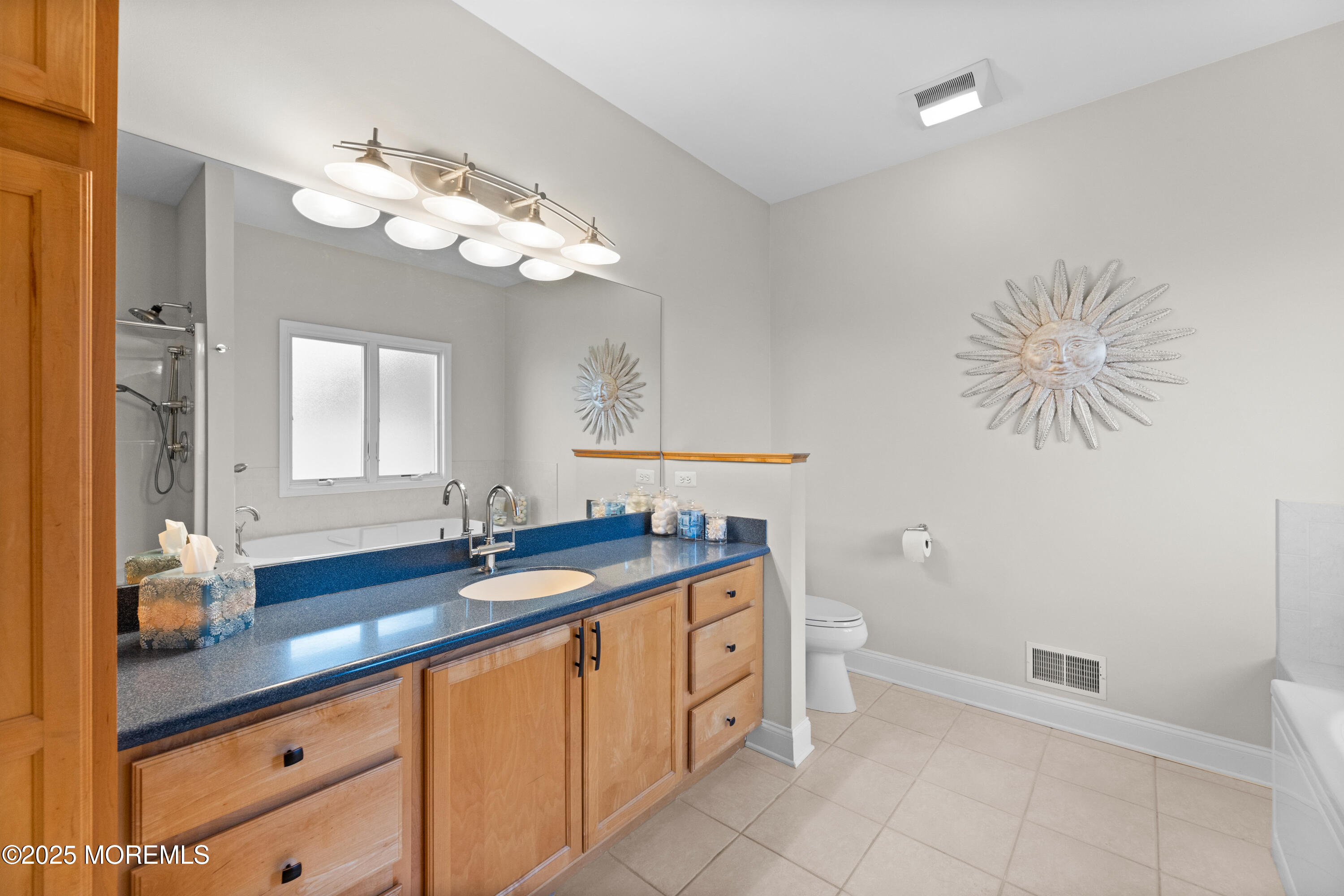 53 Edwards Road Brick, NJ 08723 - Photo 34 of 78 a spacious bathroom with a granite countertop sink a toilet and a mirror
