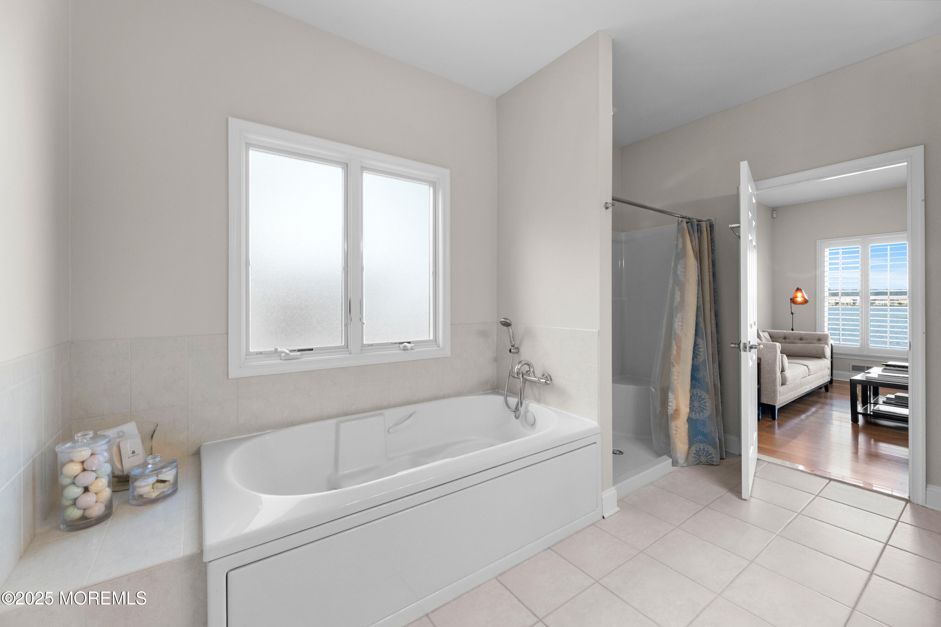 53 Edwards Road Brick, NJ 08723 - Photo 35 of 78 a bathroom with a tub and a shower