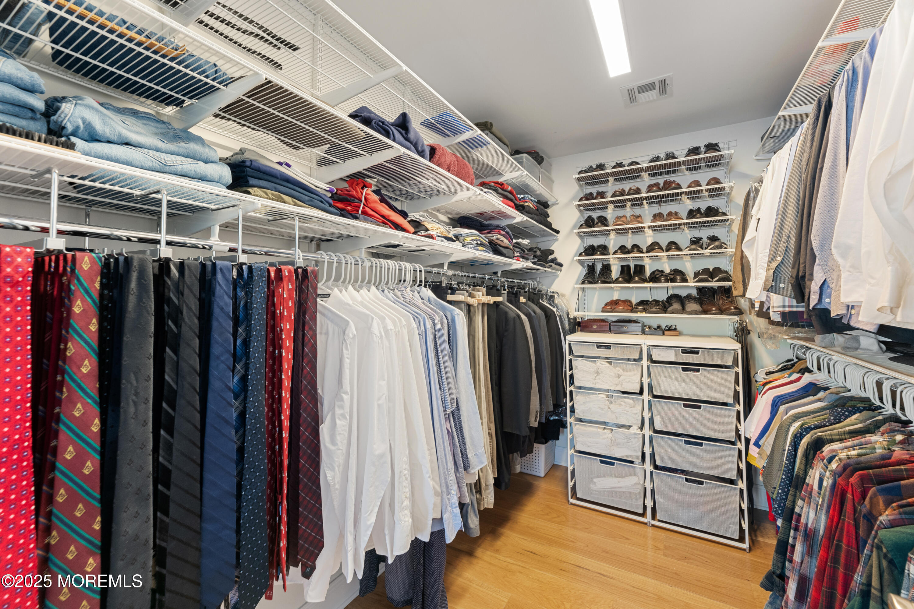 53 Edwards Road Brick, NJ 08723 - Photo 51 of 78 a view of walk in closet with clothes and shoes