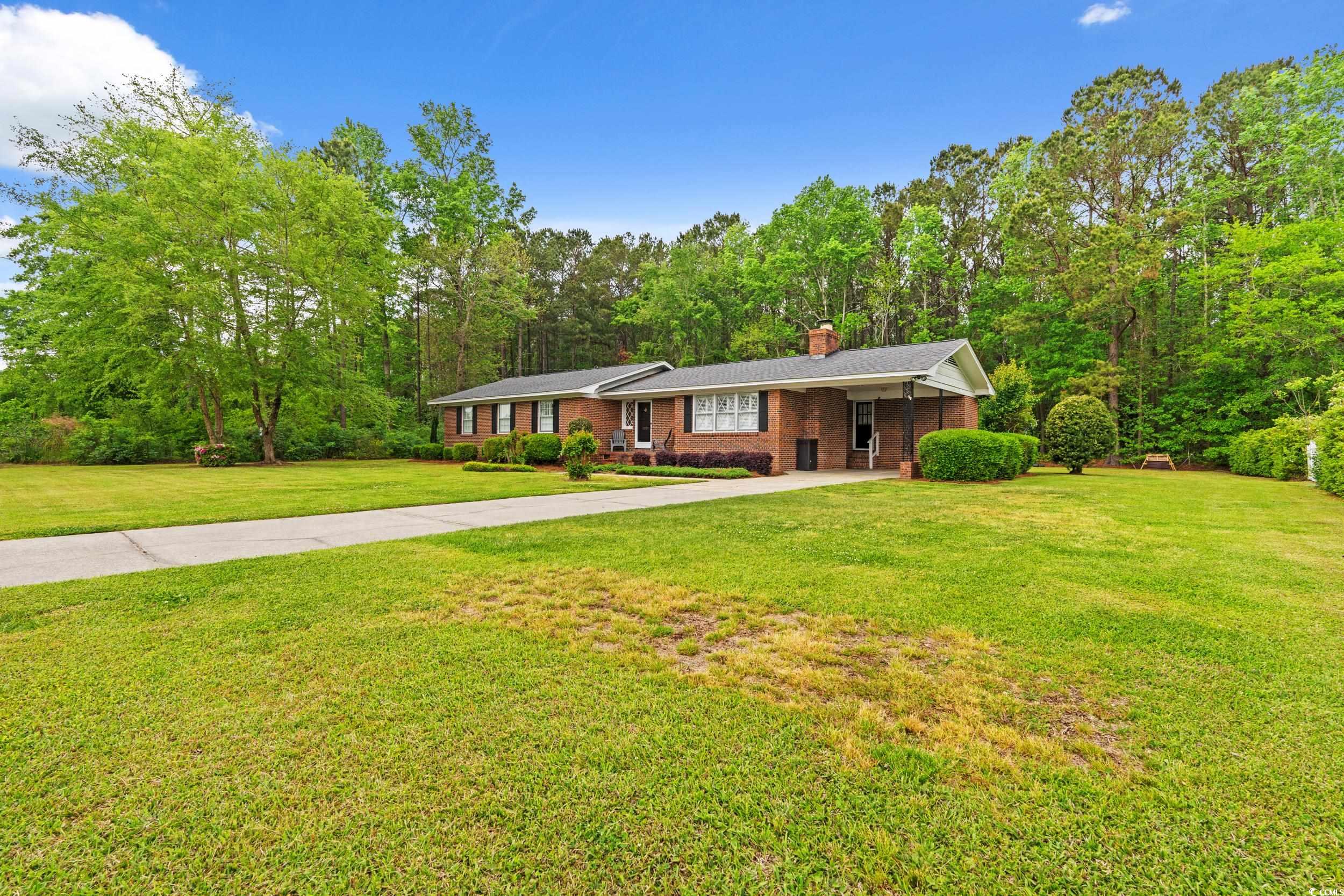 5033 State Rd S-34-470 Mullins, SC 29574 - Photo 32 of 32 Ranch-style home featuring a front lawn, a chimney
