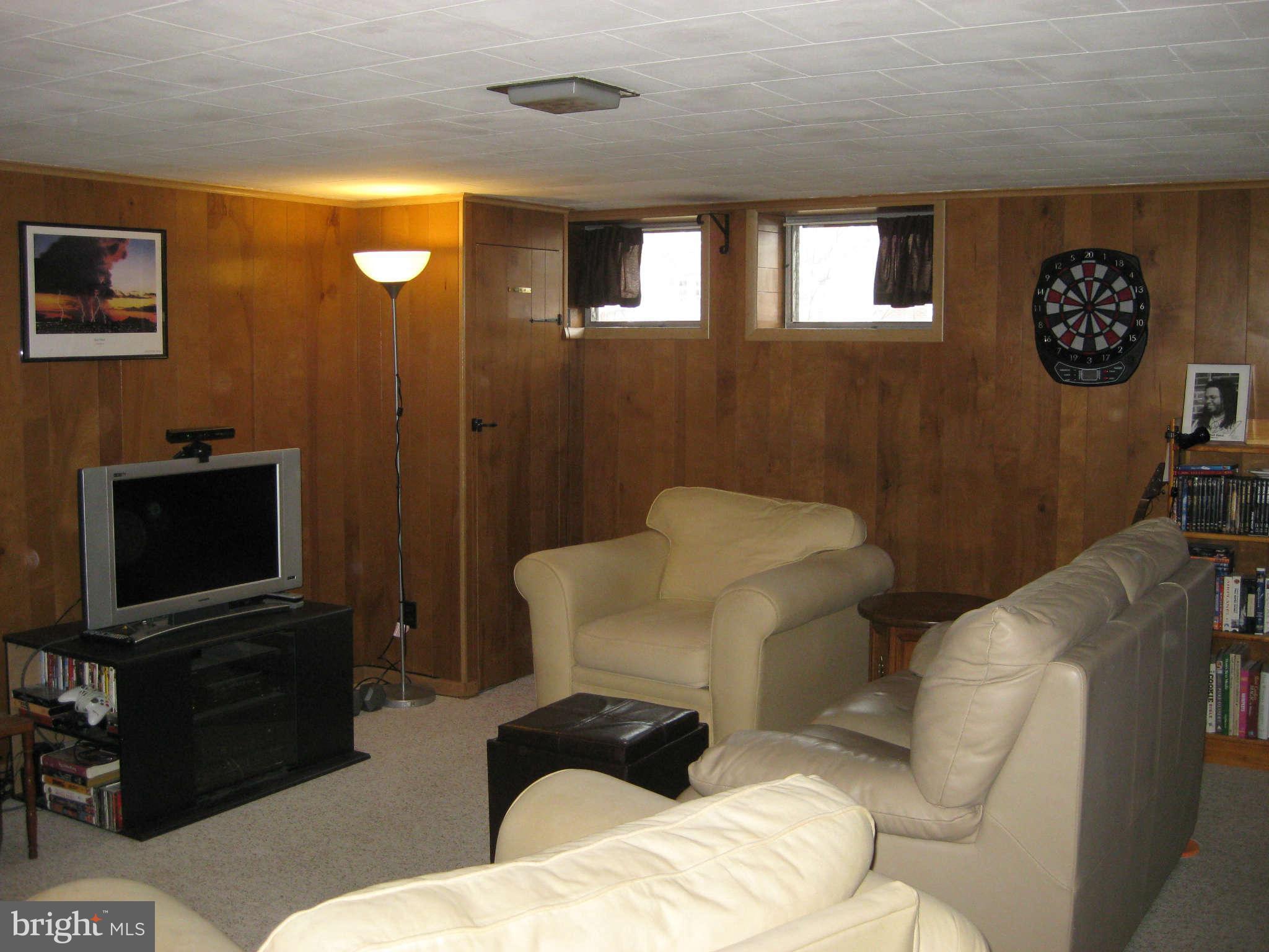 436 Greenlow Road Baltimore, MD 21228 - Photo 14 of 30 a living room with furniture and a flat screen tv