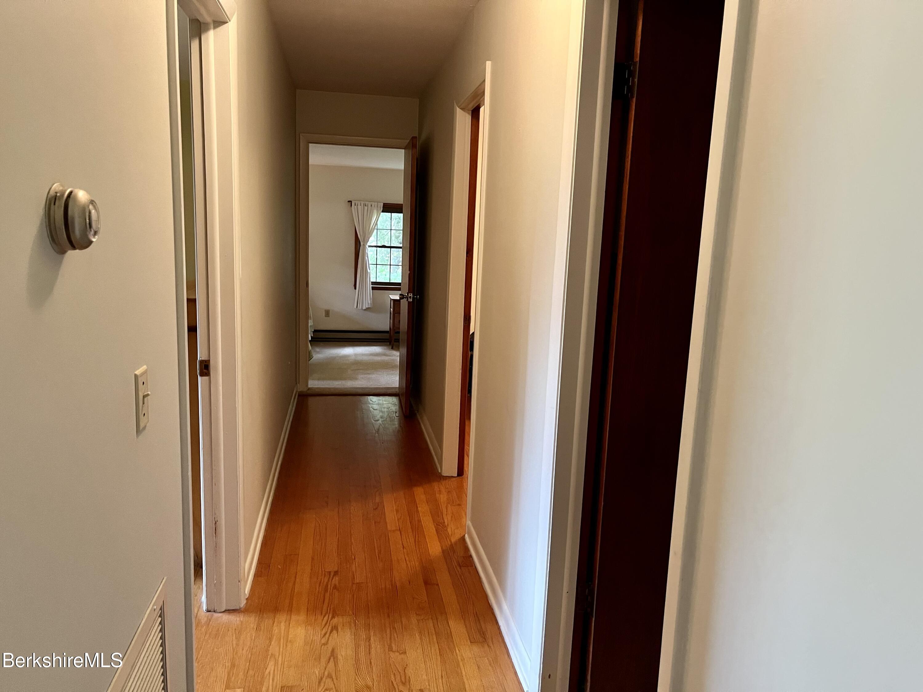 28 Chestnut Street Dalton, MA 01226 - Photo 15 of 33 a view of a hallway with a wooden floor
