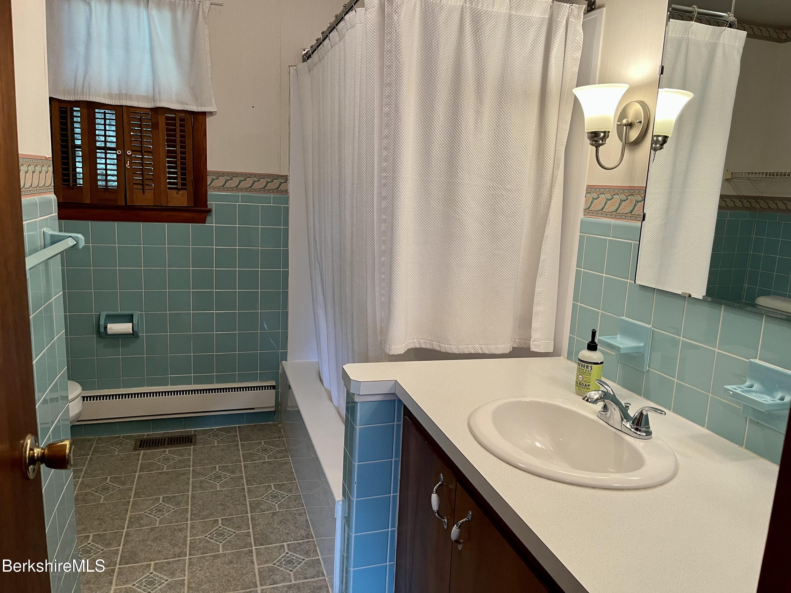 28 Chestnut Street Dalton, MA 01226 - Photo 16 of 33 a bathroom with a sink a toilet and shower