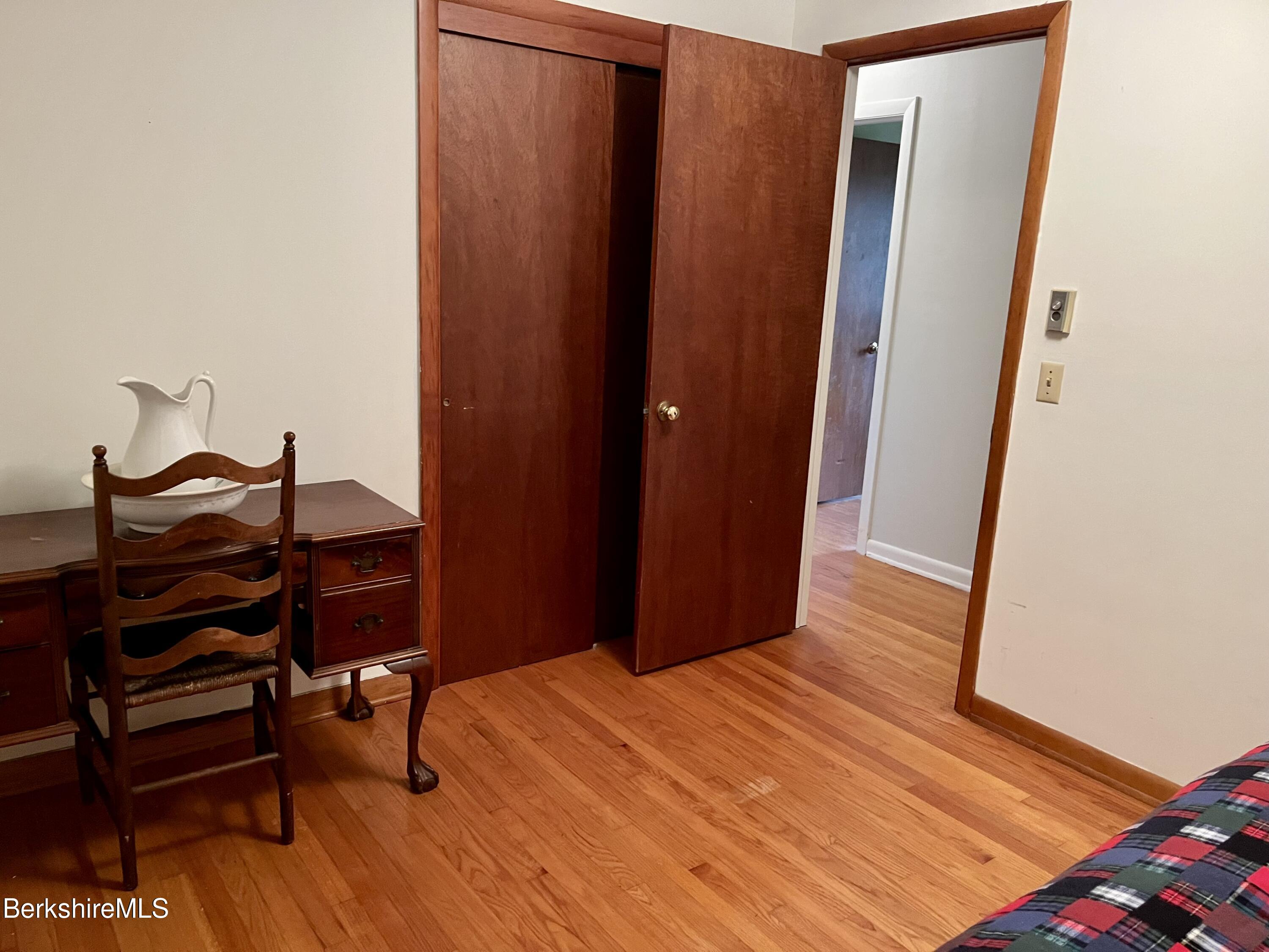 28 Chestnut Street Dalton, MA 01226 - Photo 20 of 33 a room with a bed and a mirror