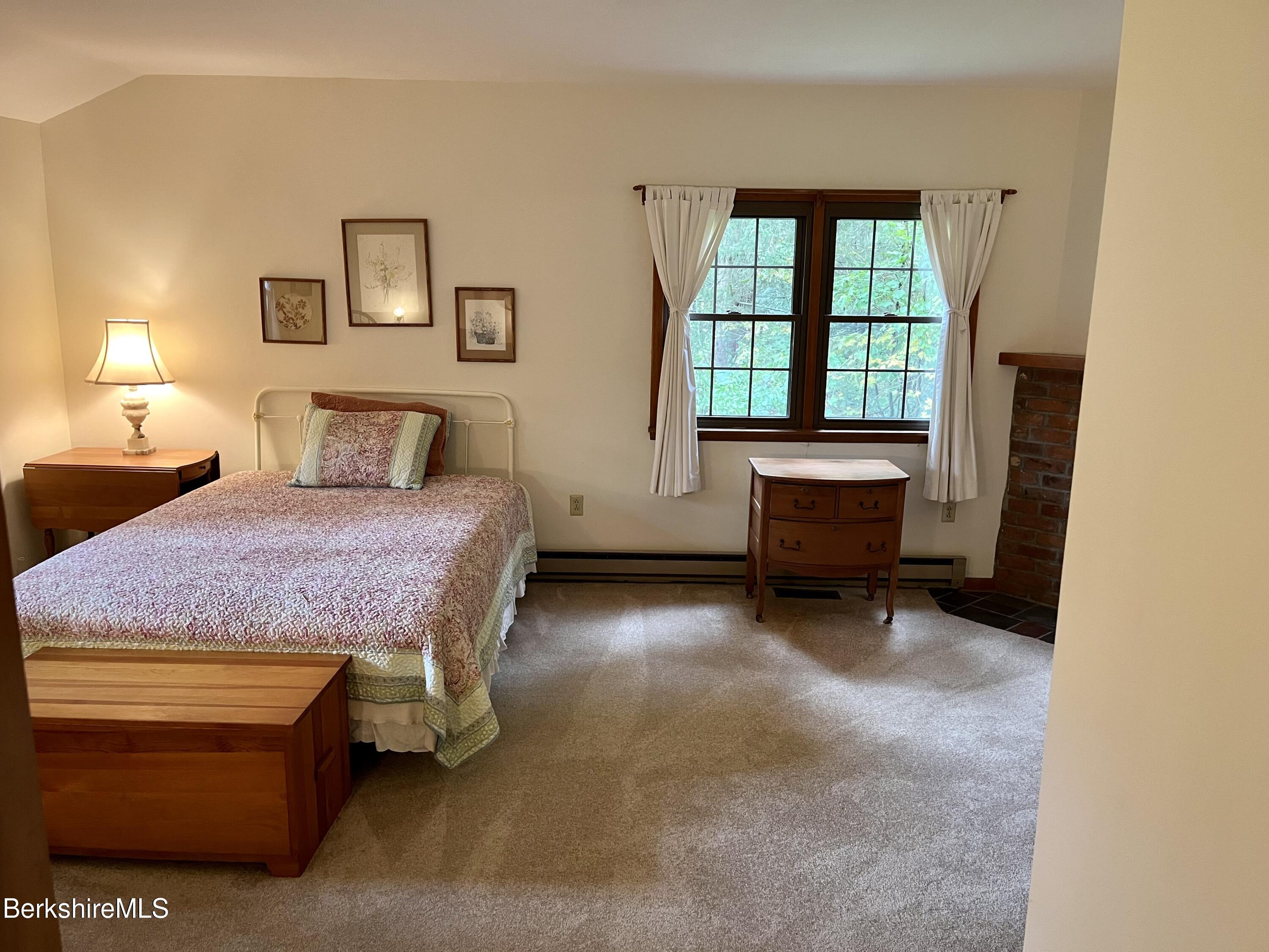 28 Chestnut Street Dalton, MA 01226 - Photo 21 of 33 a spacious bedroom with a bed and a window