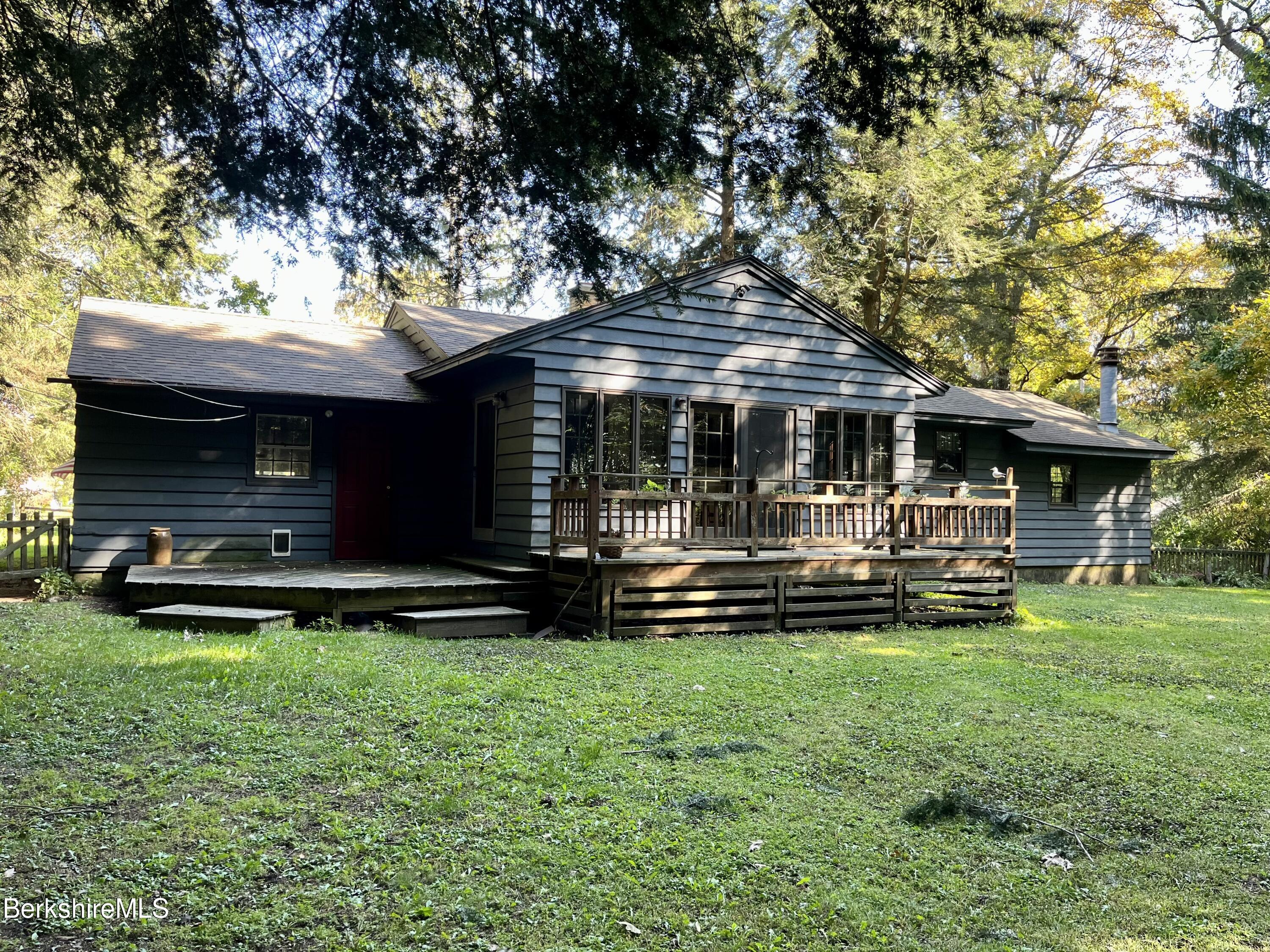 28 Chestnut Street Dalton, MA 01226 - Photo 4 of 33 a view of a house with a yard balcony and wooden fence