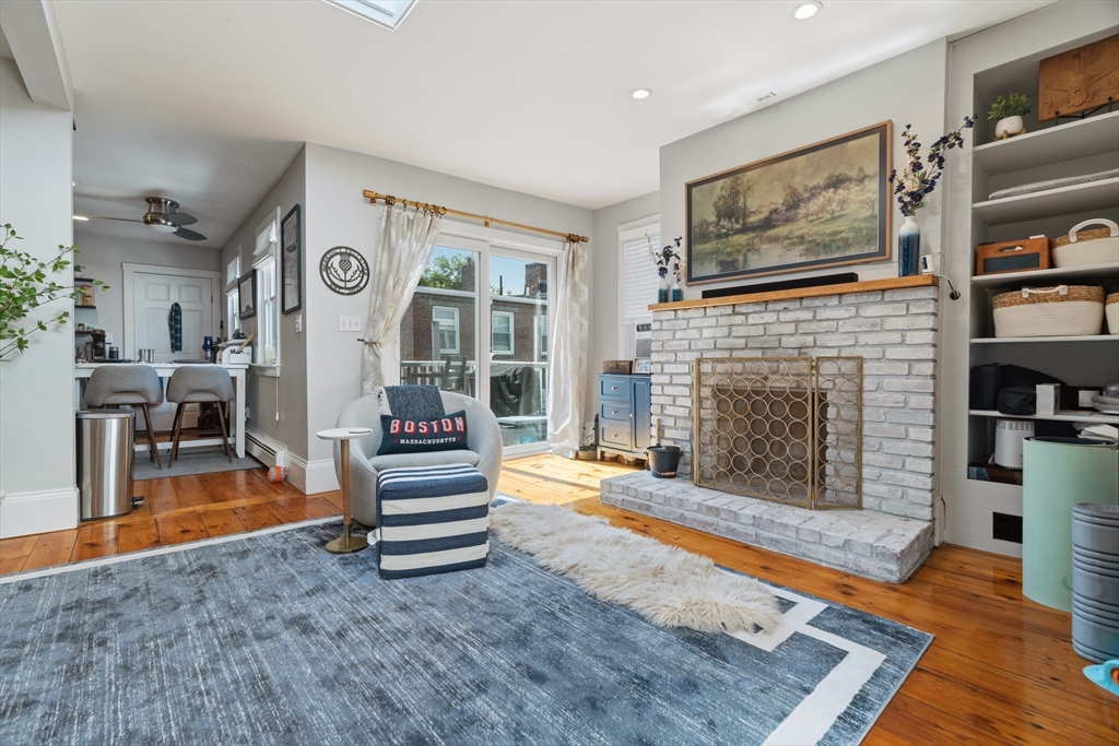 33 Mystic Street, Unit 3 Boston, MA 02129 - Photo 5 of 21 a living room with furniture and a fireplace