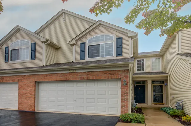 a front view of a house with yard