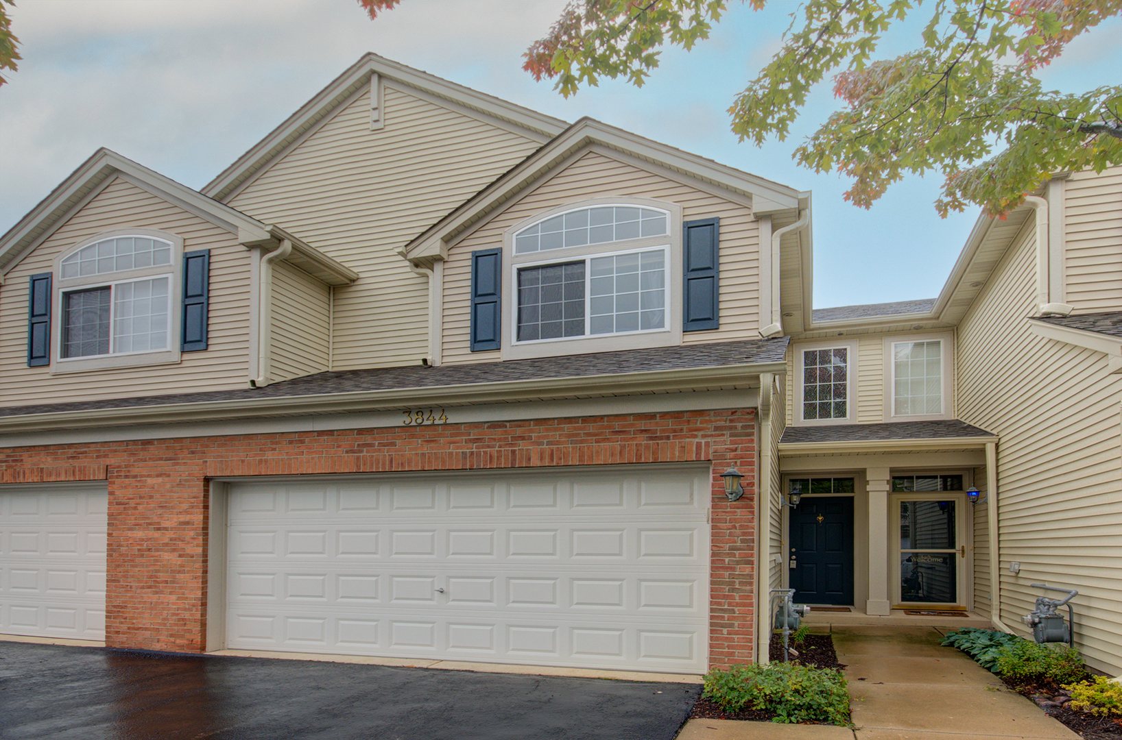 a front view of a house with yard
