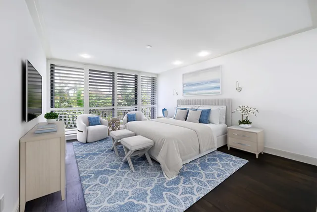 a spacious bedroom with a bed and glass window