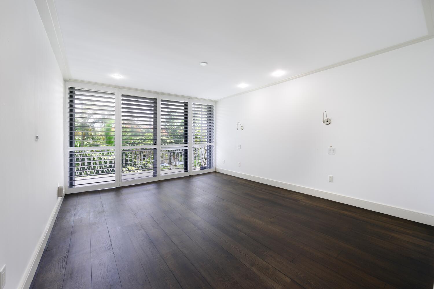 429 Australian Avenue, Unit 9 Palm Beach, FL 33480 - Photo 13 of 18 a view of a room with wooden floor and window