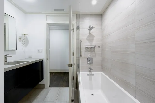 a bathroom with a bathtub and a sink