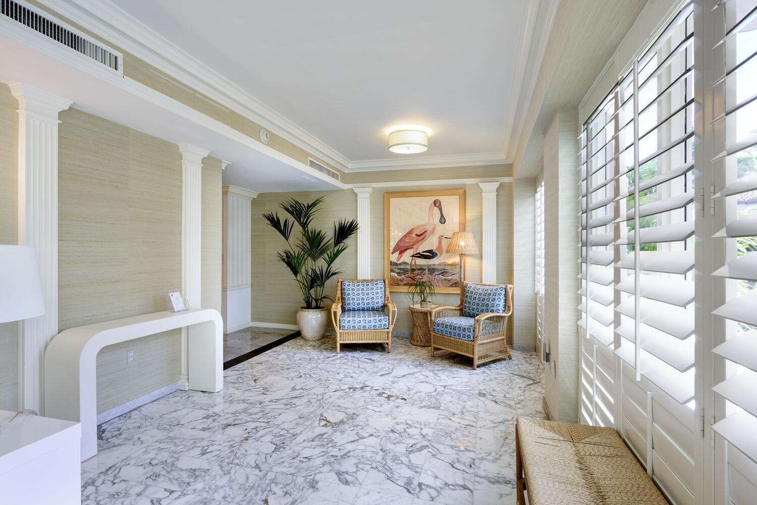 429 Australian Avenue, Unit 9 Palm Beach, FL 33480 - Photo 17 of 18 a living room with furniture and a window