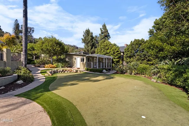 a view of a swimming pool with an outdoor space and seating area