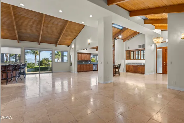 a view of an empty room with a fireplace