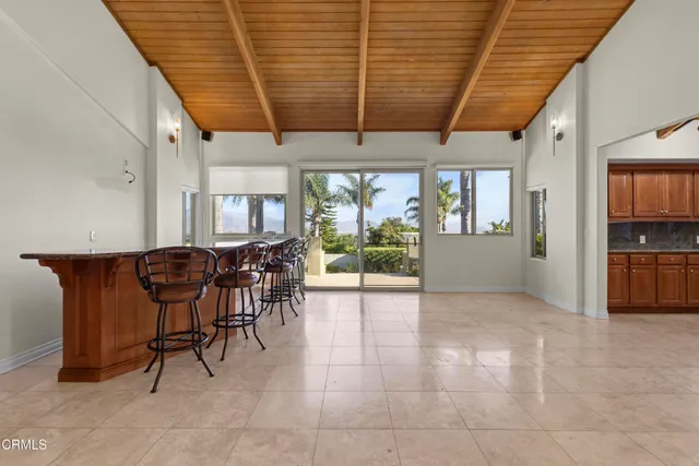 a kitchen with granite countertop cabinets and window