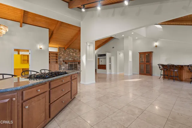 a kitchen with a stove a sink and a microwave