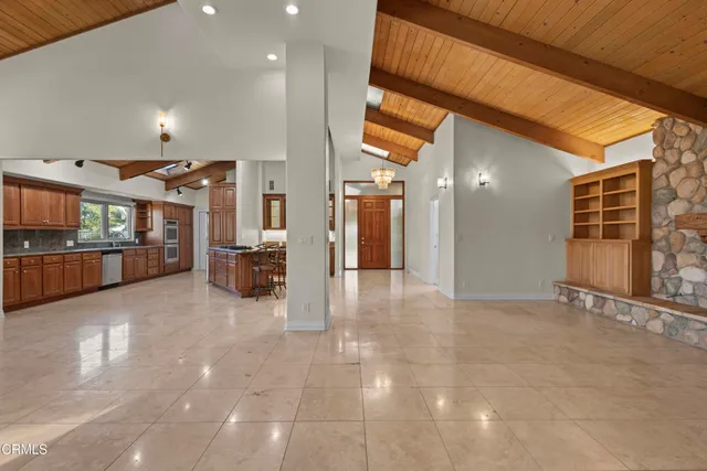 a lobby with furniture and a rug