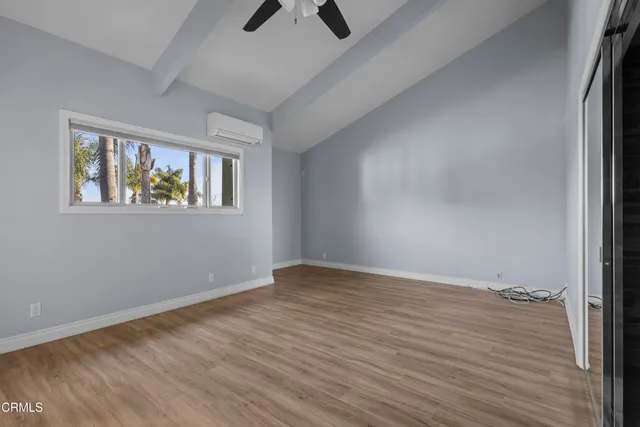 a spacious bathroom with a granite countertop sink and a mirror