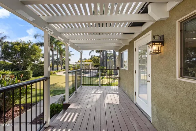 a kitchen with granite countertop a refrigerator and a stove top oven