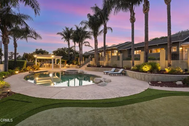 a swimming pool view with a lake view