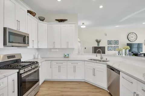 a large kitchen with lots of counter space and a sink
