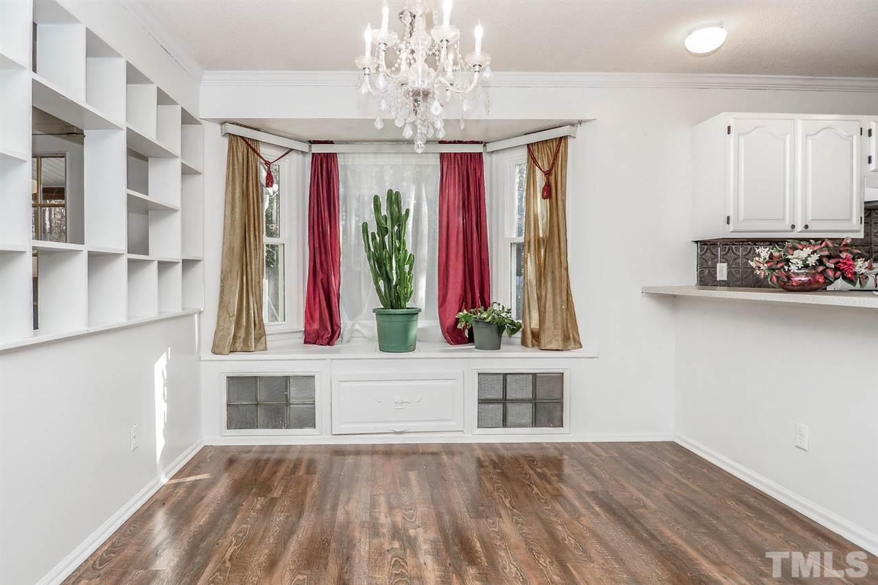 2309 Carthage Circle Raleigh, NC 27604 - Photo 11 of 23 a view of a hallway with windows and chandelier