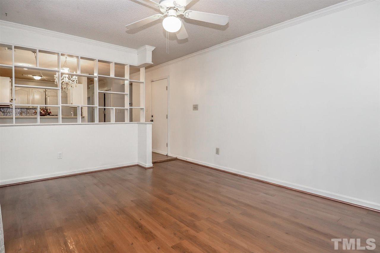 2309 Carthage Circle Raleigh, NC 27604 - Photo 14 of 23 an empty room with wooden floor and windows
