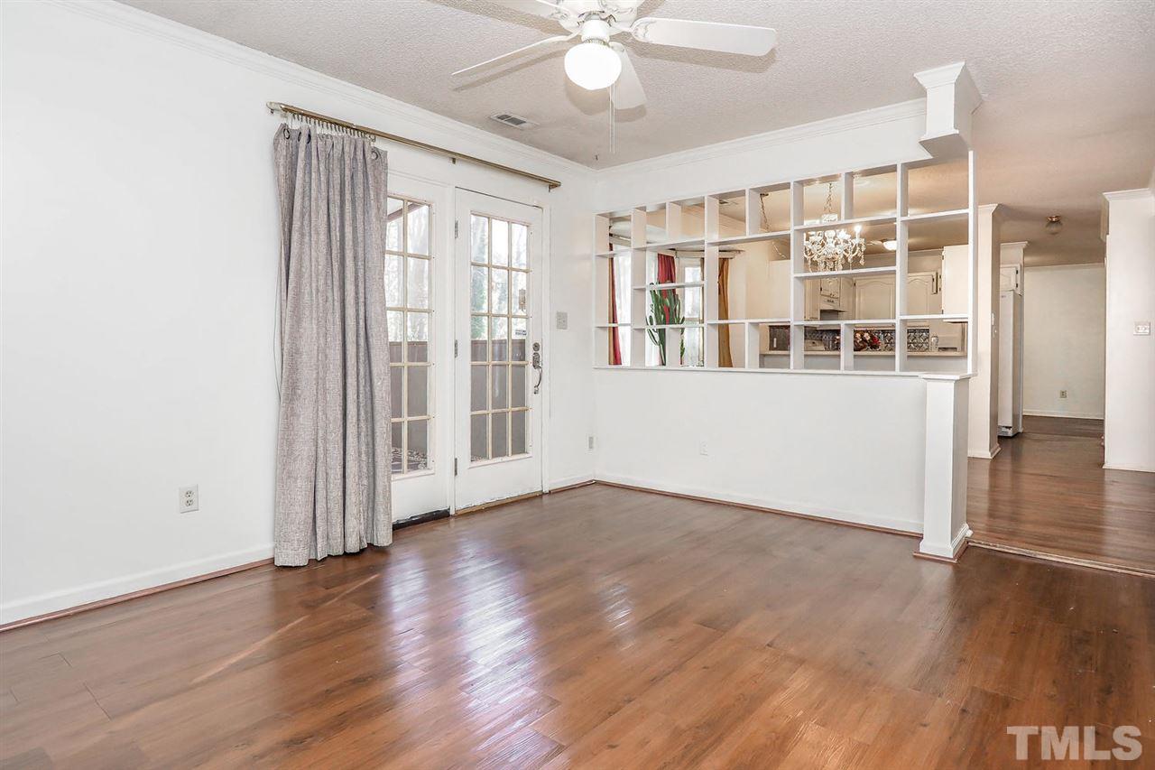 2309 Carthage Circle Raleigh, NC 27604 - Photo 15 of 23 a view of an empty room with wooden floor and a window