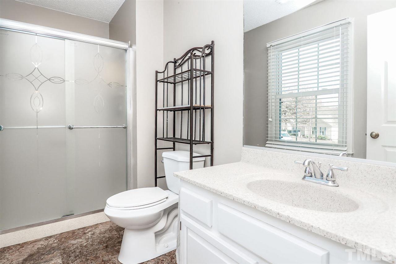 2309 Carthage Circle Raleigh, NC 27604 - Photo 18 of 23 a bathroom with a sink toilet and shower