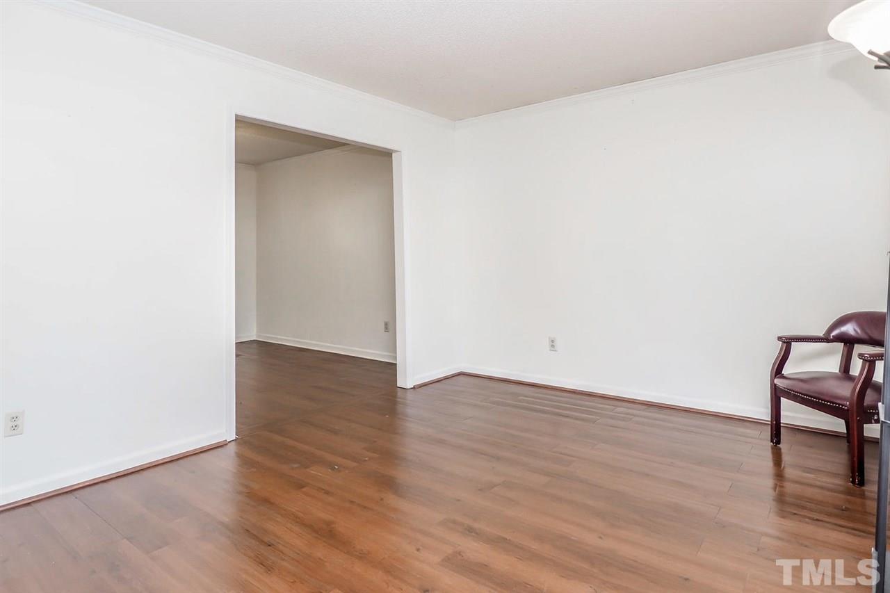 2309 Carthage Circle Raleigh, NC 27604 - Photo 3 of 23 a view of an empty room with wooden floor