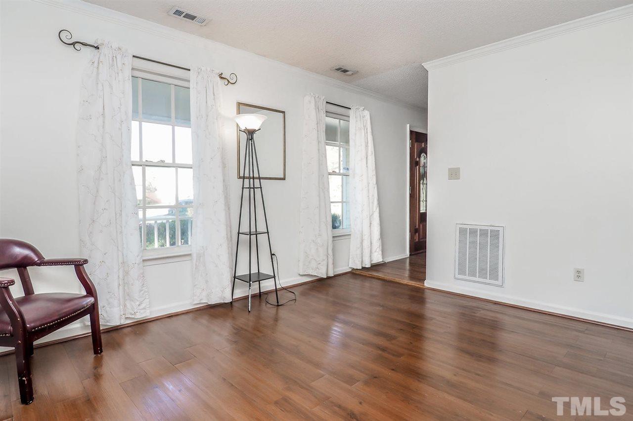 2309 Carthage Circle Raleigh, NC 27604 - Photo 5 of 23 a view of empty room with wooden floor and fan