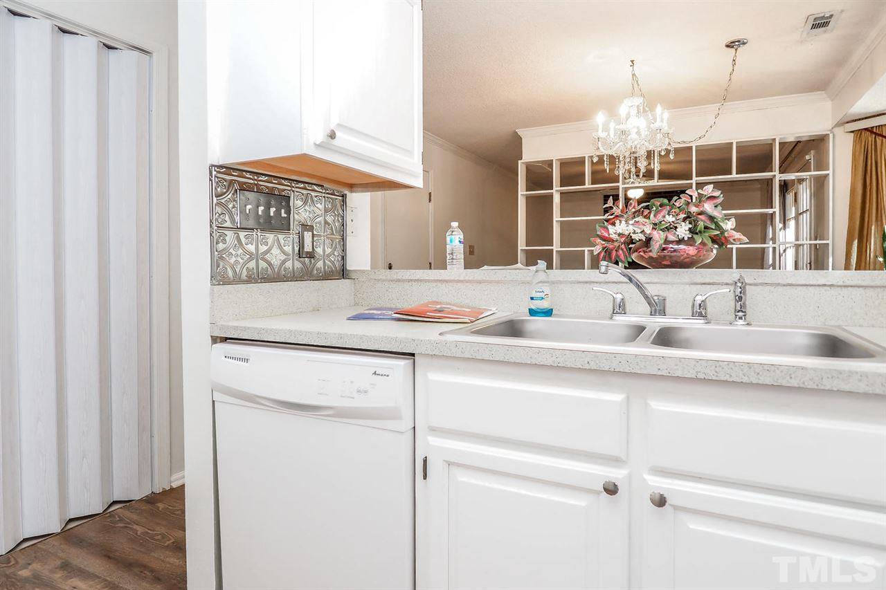 2309 Carthage Circle Raleigh, NC 27604 - Photo 9 of 23 a view of a kitchen with a sink and mirror