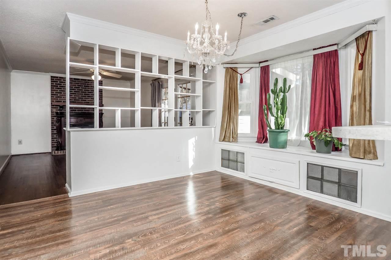 2309 Carthage Circle Raleigh, NC 27604 - Photo 10 of 23 a view of a big room with wooden floor and windows
