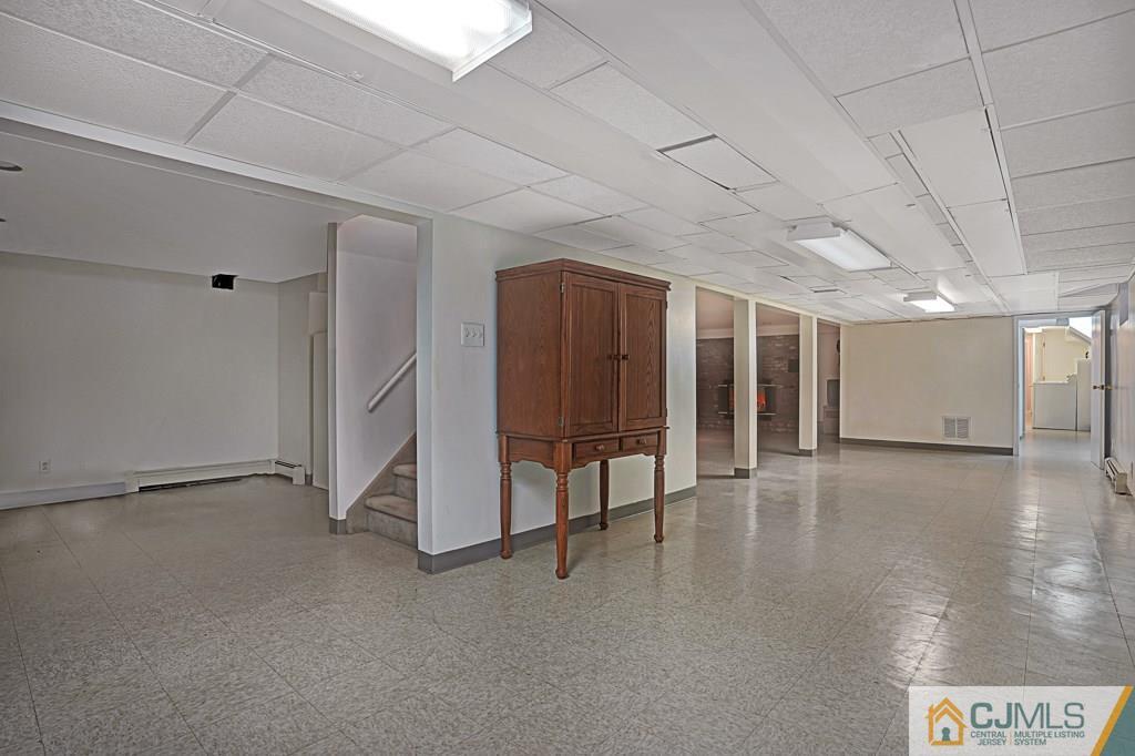 1081 Raritan Road Scotch Plains, NJ 07076 - Photo 19 of 27 a view of an empty room with wooden floor