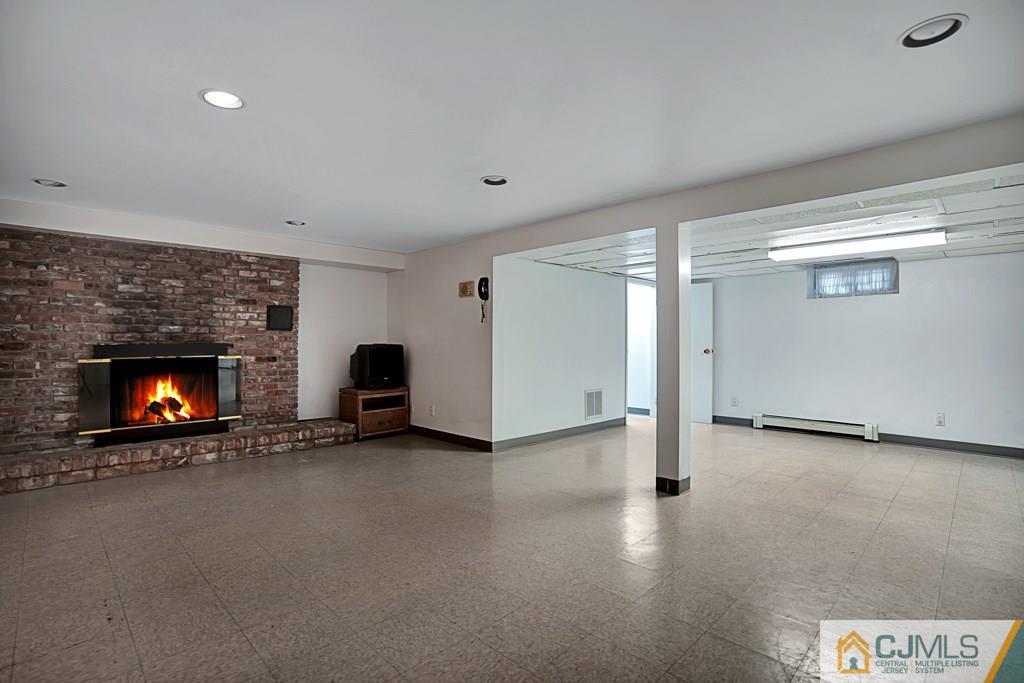 1081 Raritan Road Scotch Plains, NJ 07076 - Photo 20 of 27 a view of an empty room with a fireplace