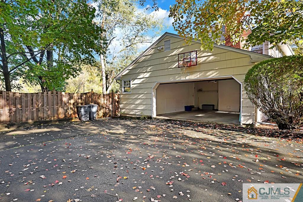 1081 Raritan Road Scotch Plains, NJ 07076 - Photo 23 of 27 a view of a grey house with a yard